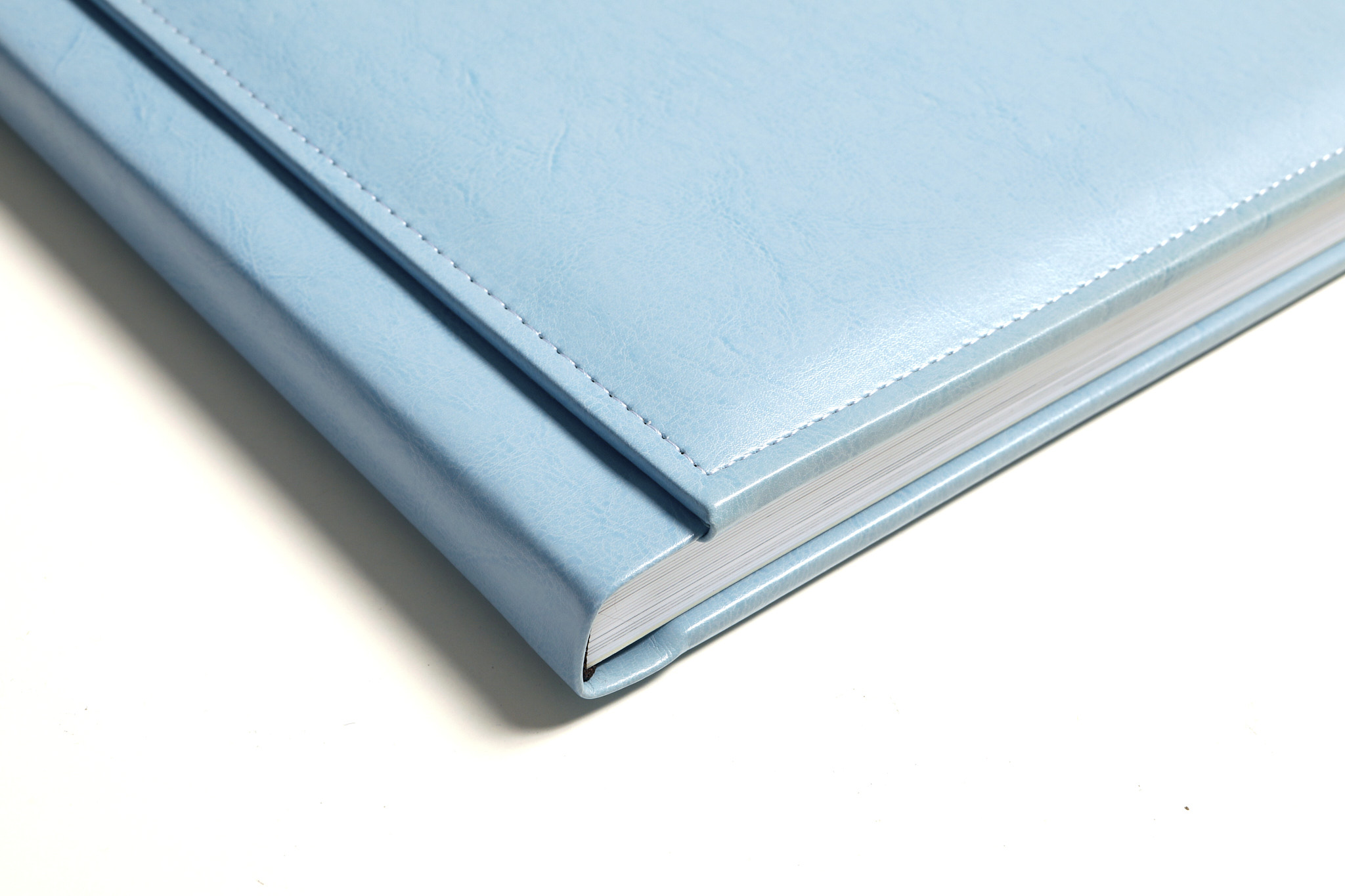 Hand-bound light blue leather christening album